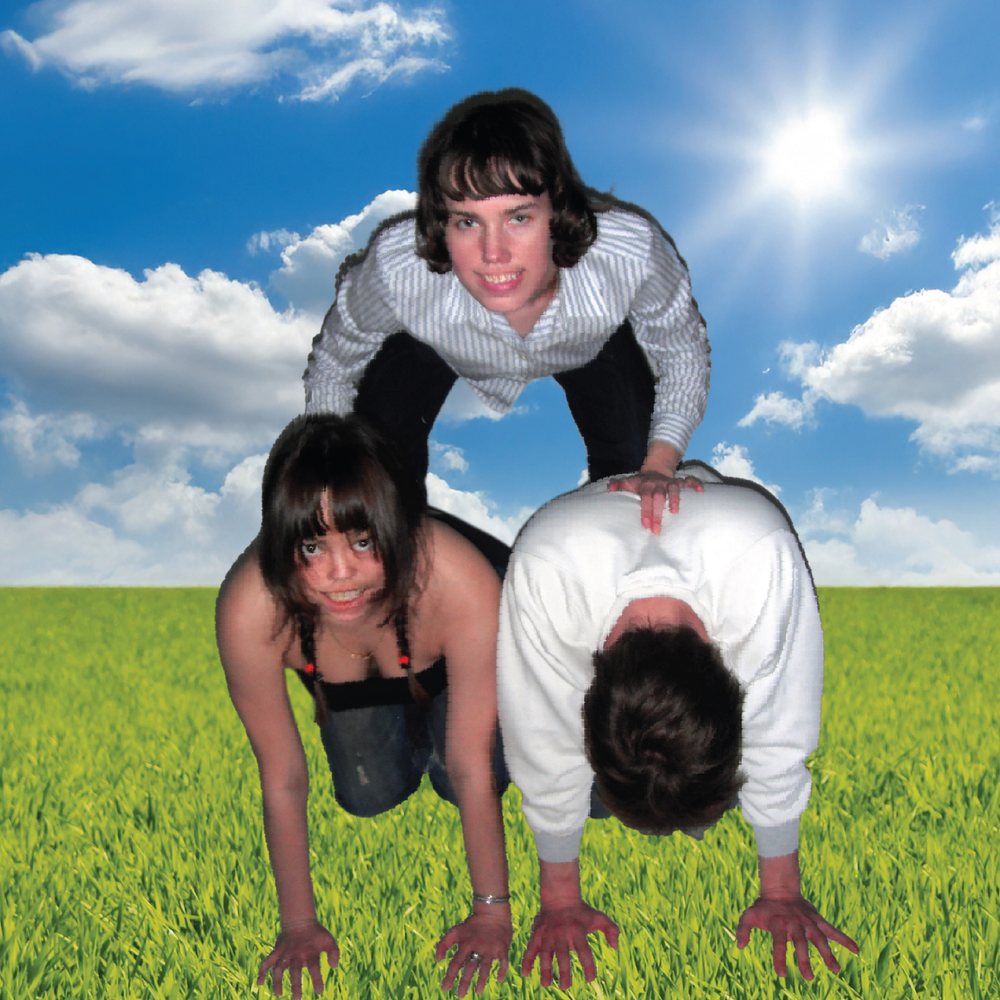 sauna6, Megan, and Hana in a human pyramid on bright green grass under a blue sky